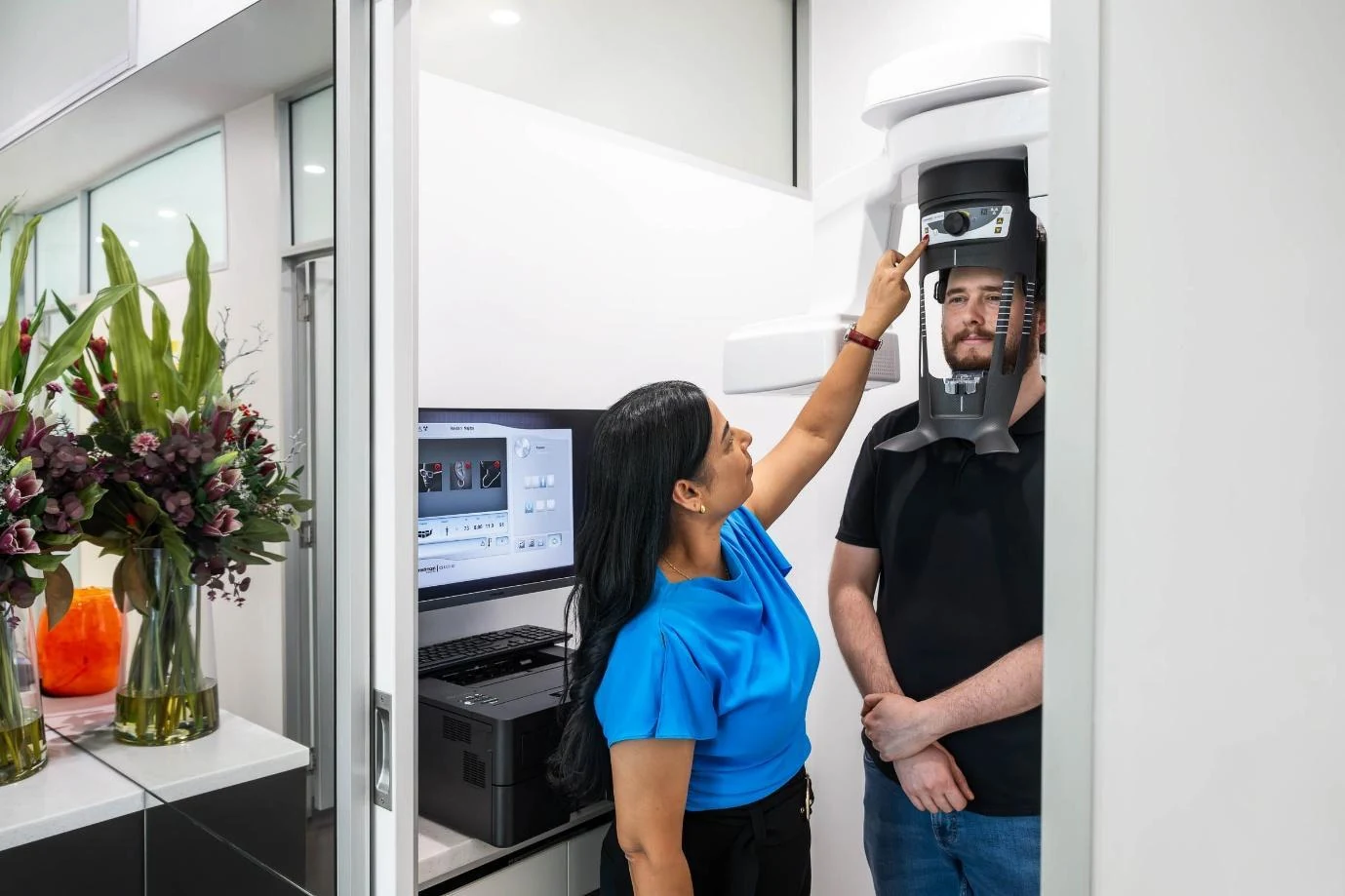 Dr Renu Karn positioning a patient in the CBCT scanner
